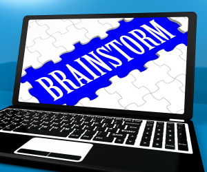 Brainstorm Puzzle On Notebook Showing Ideas And Inspiration For E-book